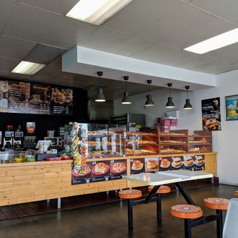 Donut Boss - There's a numbered menu of breakfast sandwiches right below the donut display - Donuts Near Me - Westminster, California