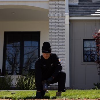 The Termite Division - Licensed inspector marking placement for a termite bait station in Scottsdale -- a strategic first step to protect your home foundation. - Pest Control Near Me - Mesa, Arizona