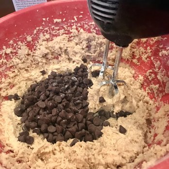 Frosted Sunshine - a mixing bowl filled with chocolate chips - Desserts Near Me Frosted Sunshine - a mixing bowl filled with chocolate chips - Desserts Near Me
