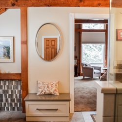 Cabinet World - The vaulted ceilings and beautiful woodwork carried over into this client's bathroom, making for an impressive contrast against the beige.
