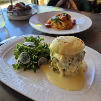Cino - Crab cake eggs Benedict, spaghetti pomodoro and crispy parmesan potatoes. - Italian Near Me - Honolulu, Hawaii Cino - Crab cake eggs Benedict, spaghetti pomodoro and crispy parmesan potatoes. - Italian Near Me - Honolulu, Hawaii