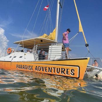 Paradise Adventures - picture of boat and assistant tanner watching over the snorkelers for safety - Boat Charters Near Me - Panama City Beach, Florida Paradise Adventures - picture of boat and assistant tanner watching over the snorkelers for safety - Boat Charters Near Me - Panama City Beach, Florida