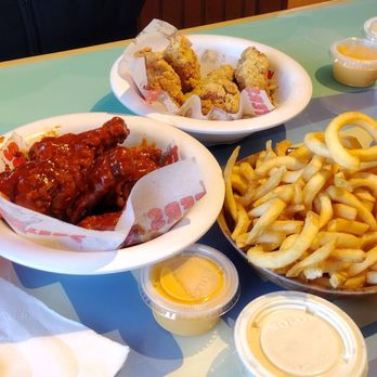 Hooters - Our usual garlic parmesan and chipotle bbq, with a side of  and can't forget the cheese for fries..best time to come after 1 pm - American Near Me - Chicago, Illinois