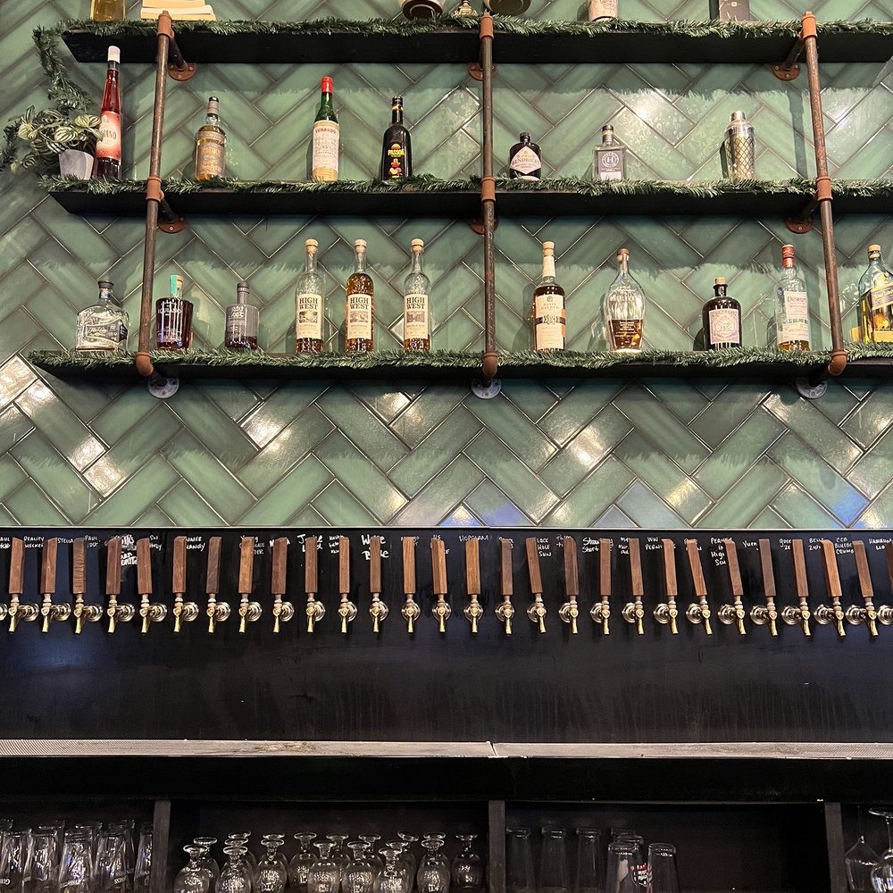 The Brass Tap - a row of beer taps on the wall - Sports Bars Near Me - Wesley Chapel, Florida The Brass Tap - a row of beer taps on the wall - Sports Bars Near Me - Wesley Chapel, Florida