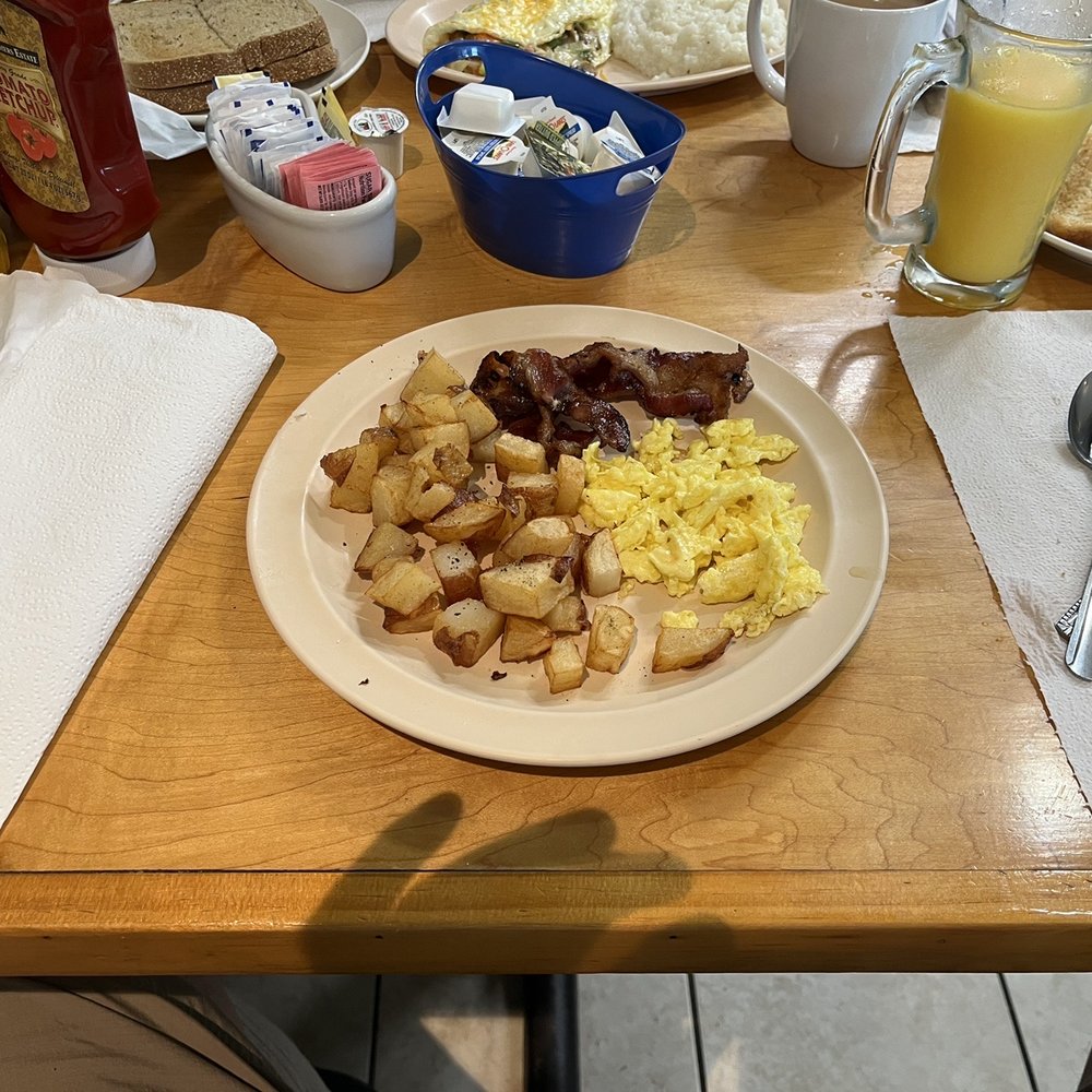 One egg scrambled with bacon and breakfast potatoes. One egg scrambled with bacon and breakfast potatoes.