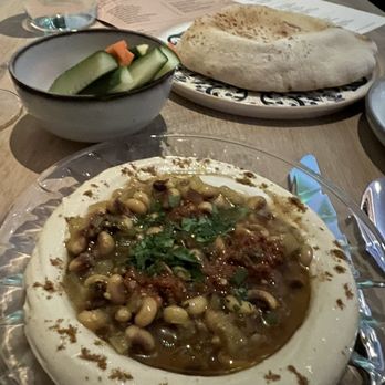 Ladino - Hummus!  Best, hands down!  Pita in the background and crudités. - Mediterranean Near Me - San Antonio, Texas