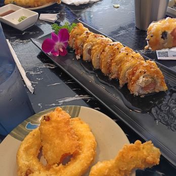 Aza Sushi - Vegetable tempura with partially eaten golden philly roll - Sushi Bars Near Me - Lake Elsinore, California Aza Sushi - Vegetable tempura with partially eaten golden philly roll - Sushi Bars Near Me - Lake Elsinore, California
