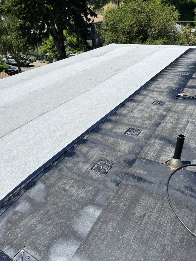 Slide of Nick’s Roofing