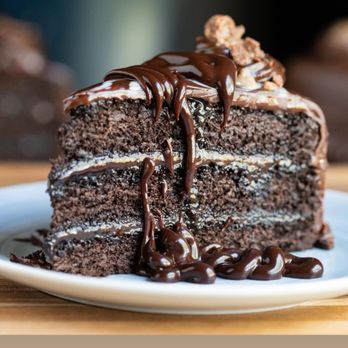 H-Town Bistro - Our cool chocolate ganache cake - Italian Near Me - Houston, Texas H-Town Bistro - Our cool chocolate ganache cake - Italian Near Me - Houston, Texas