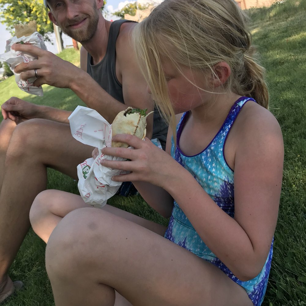 Pita Pit - a man and a little girl eating sandwiches - Fast Food Near Me - Moses Lake, Washington Pita Pit - a man and a little girl eating sandwiches - Fast Food Near Me - Moses Lake, Washington