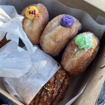 Rose Ave Bakery - Donuts: passion fruit, ube coconut, pandan coconut (not pictured: black sesame) Musubi croissant in wrapping :) - Bakeries Near Me - Washington, DC, District of Columbia Rose Ave Bakery - Donuts: passion fruit, ube coconut, pandan coconut (not pictured: black sesame) Musubi croissant in wrapping :) - Bakeries Near Me - Washington, DC, District of Columbia