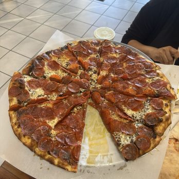 Burattino Brick Oven Pizza - Black garlic 120 pepperoni pizza with "extra cheese" (questionable). Awesome! - Pizza Near Me - Whittier, California Burattino Brick Oven Pizza - Black garlic 120 pepperoni pizza with "extra cheese" (questionable). Awesome! - Pizza Near Me - Whittier, California