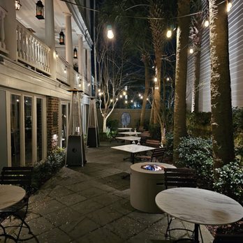 Zero Restaurant + Bar - tables and chairs outside at night - New American Near Me - Charleston, South Carolina Zero Restaurant + Bar - tables and chairs outside at night - New American Near Me - Charleston, South Carolina