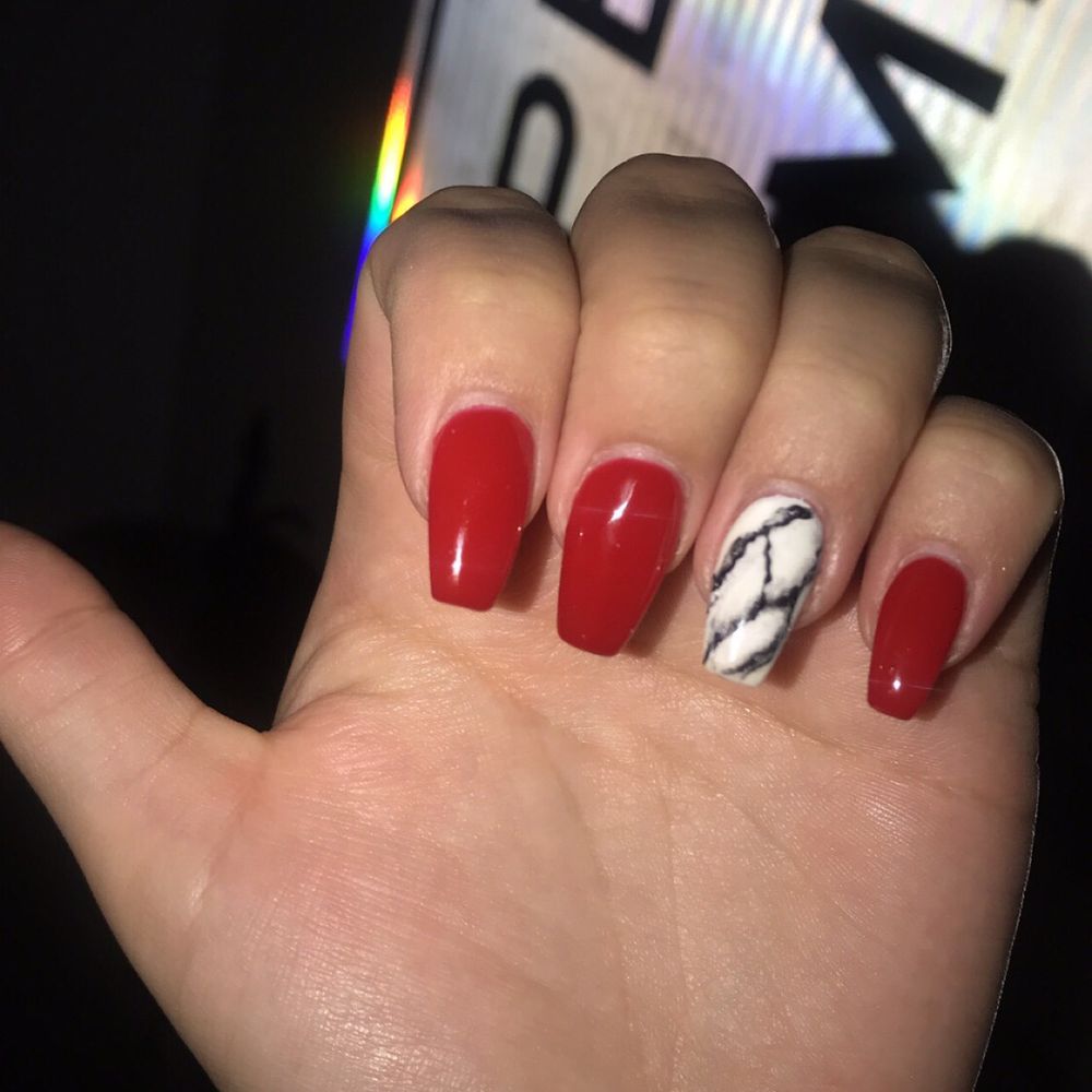 Acrylic nail with red nail polish and a marble accent with white and black nail polish.  New set= $47