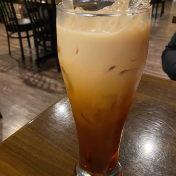 Thai Vegan - a glass of iced coffee on a table - Thai Near Me - Greer, South Carolina Thai Vegan - a glass of iced coffee on a table - Thai Near Me - Greer, South Carolina