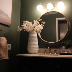 Guest bath transformation. 
We used the color Rosemary by Sherwin Williams and used brass finishes to compliment the color beautifully.