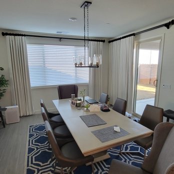 Jackyes Drapery - Custom drapery panels on a wood rod paired with faux wood blinds for layered light control and a finished dining space. - Shades & Blinds Near Me - Roseville, California Jackyes Drapery - Custom drapery panels on a wood rod paired with faux wood blinds for layered light control and a finished dining space. - Shades & Blinds Near Me - Roseville, California