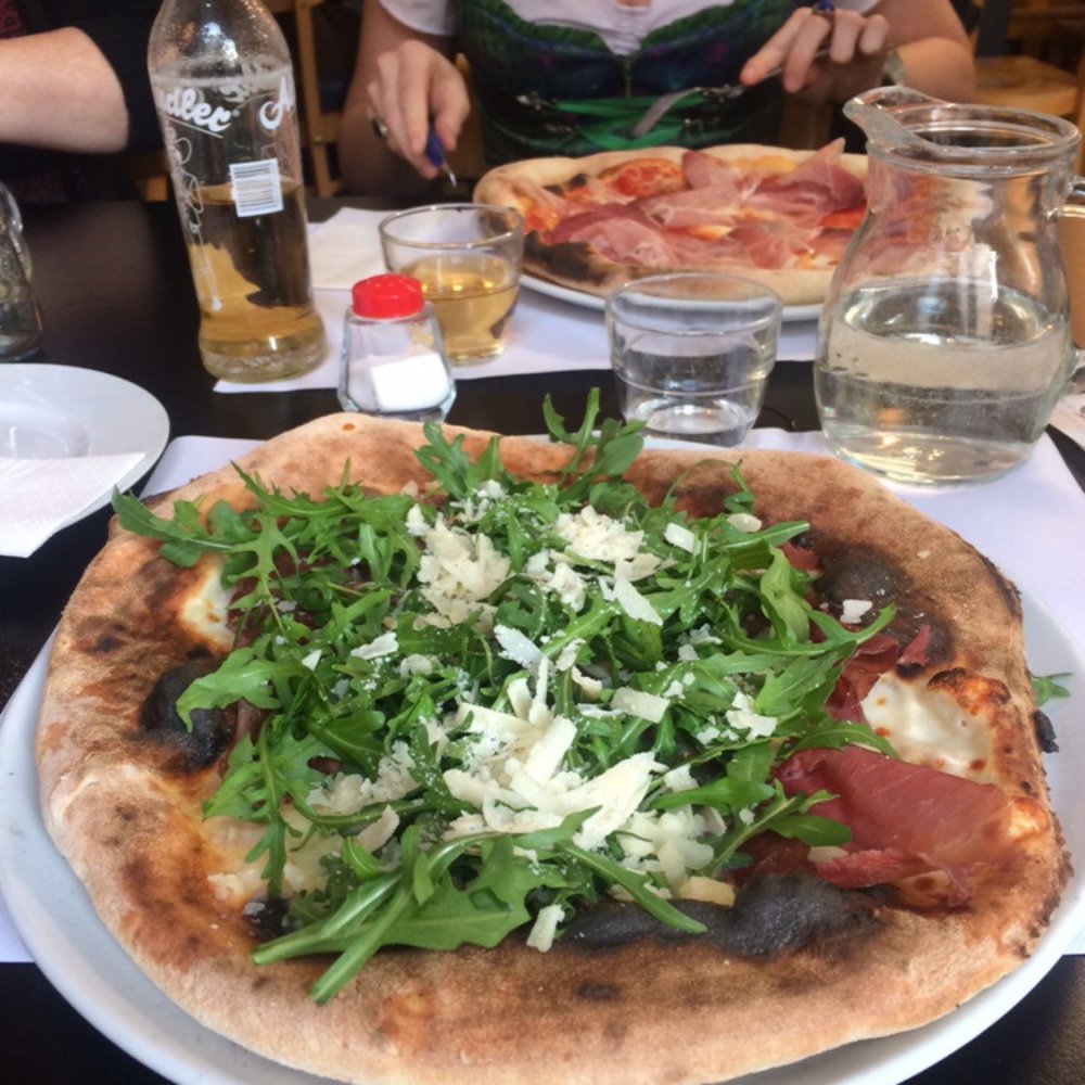 Pizza Bresaola and a girl in a dirndl. Pizza Bresaola and a girl in a dirndl.