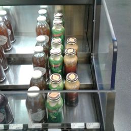 a display case with jars of condiments a display case with jars of condiments