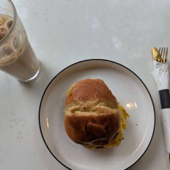 Novela Cafe Social - Iced latte and egg on potato bun - Breakfast & Brunch Near Me - Miami, Florida