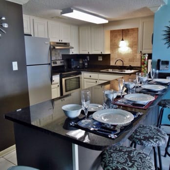 Island Sunrise - The kitchen is stocked with everything one would need and features granite countertops, stainless steel appliances, and more - Vacation Rentals Near Me - Gulf Shores, Alabama Island Sunrise - The kitchen is stocked with everything one would need and features granite countertops, stainless steel appliances, and more - Vacation Rentals Near Me - Gulf Shores, Alabama