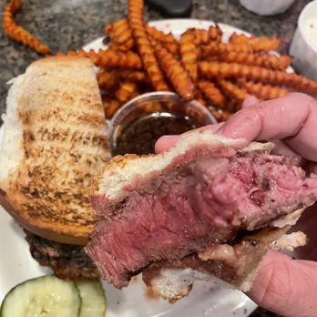 Greystone Castle - Prime rib sourdough sandwich and side order of sweet potatoes. - Bars Near Me - Sturgeon Bay, Wisconsin Greystone Castle - Prime rib sourdough sandwich and side order of sweet potatoes. - Bars Near Me - Sturgeon Bay, Wisconsin
