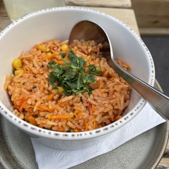 Anejo - a bowl of rice and a glass of water - Mexican Near Me - Banff, Alberta