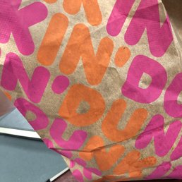 a bag of donuts on a table a bag of donuts on a table
