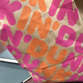 Dunkin' - a bag of donuts on a table - Coffee & Tea Near Me - Melville, New York Dunkin' - a bag of donuts on a table - Coffee & Tea Near Me - Melville, New York