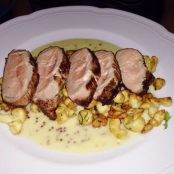 Petit Louis Bistro - Pork loin with mustard sauce and spatzel - French Near Me - Baltimore, Maryland