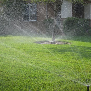Cabanas Landscape - a sprinkler spraying water on a lawn - Landscaping Near Me