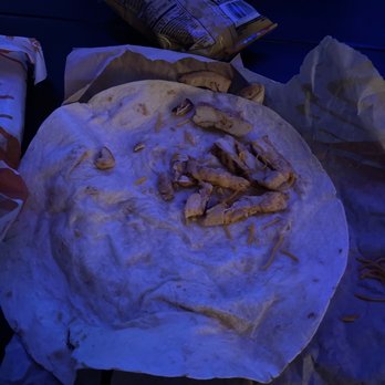 Taco Bell - an uncooked burrito on a table - Fast Food Near Me - Savannah, Georgia Taco Bell - an uncooked burrito on a table - Fast Food Near Me - Savannah, Georgia