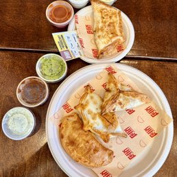 Pulled Chorizo, Lobster Corn & Chive, Four Cheese, and Pizza Empanadas Pulled Chorizo, Lobster Corn & Chive, Four Cheese, and Pizza Empanadas