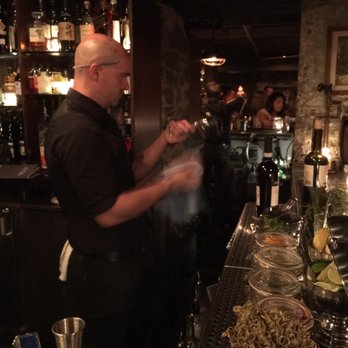 Tanner Smiths - Bartender cleans glass routinely before pouring wine - Cocktail Bars Near Me - New York, New York Tanner Smiths - Bartender cleans glass routinely before pouring wine - Cocktail Bars Near Me - New York, New York
