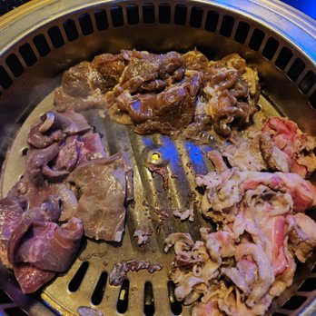 Manna BBQ | Westgate - meat being cooked on a grill - Korean Near Me - Glendale, Arizona