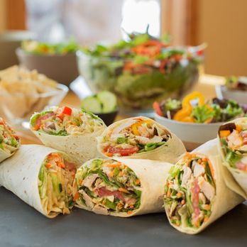 California Wrap Runner - a variety of wraps on a table - Food Trucks Near Me California Wrap Runner - a variety of wraps on a table - Food Trucks Near Me