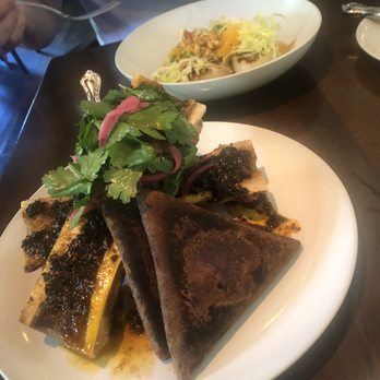 Nobie's - Bone marrow, curry scallops in the background - New American Near Me - Houston, Texas Nobie's - Bone marrow, curry scallops in the background - New American Near Me - Houston, Texas