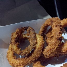 Overcooked (burnt) greasy onion rings. Overcooked (burnt) greasy onion rings.