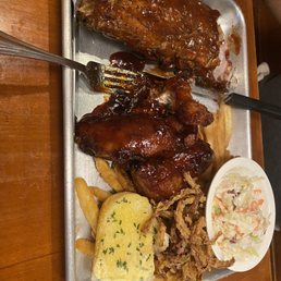 Ribs & Wings with coleslaw, fries, and garlic bread.