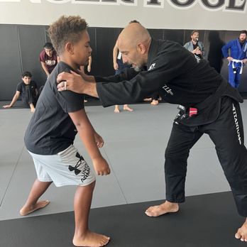 Titanium Jiu Jitsu - Noah getting a lesson from owner Amir - Brazilian Jiu-jitsu Near Me - San Jose, California