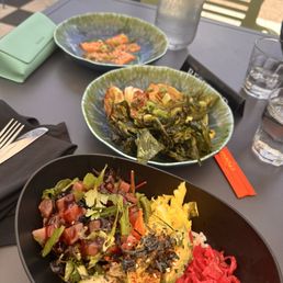 Front black bowl is the truffle tuna poke bowl Front black bowl is the truffle tuna poke bowl