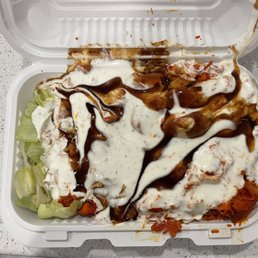 My go to: chicken over rice with bbq sauce and white sauce, $8