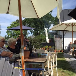 Hörte Brygga - Pretty parasols and chairs inviting you to stay.