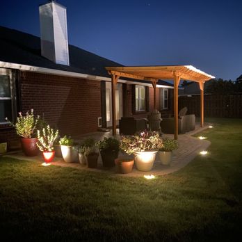 Stone Family Services - a patio at night - Landscaping Near Me Stone Family Services - a patio at night - Landscaping Near Me