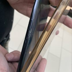 Talk N Fix - Damage to the phone done by the employee, the dent on the middle of the phone was not there prior to pickup.
