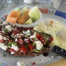 Avocado toast with eggs over easy