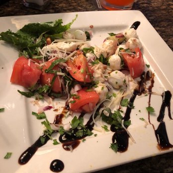 BJ's Restaurant & Brewhouse - Mozzarella and tomato salad. Refreshing - New American Near Me - Gainesville, Florida BJ's Restaurant & Brewhouse - Mozzarella and tomato salad. Refreshing - New American Near Me - Gainesville, Florida