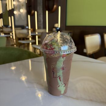 Pistachio Sweets - Dubai chocolate with strawberries in a cup inside their newly redecorated lounge. - Desserts Near Me - Morton Grove, Illinois Pistachio Sweets - Dubai chocolate with strawberries in a cup inside their newly redecorated lounge. - Desserts Near Me - Morton Grove, Illinois