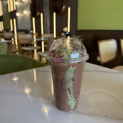 Pistachio Sweets - Dubai chocolate with strawberries in a cup inside their newly redecorated lounge.