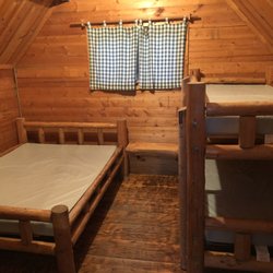 Jackson Hole / Snake River KOA - Inside my cabin, a full size bed and a bunkbed. Unfortunately the KOA does not offer linens, blankets and pillows. They do warn you about it